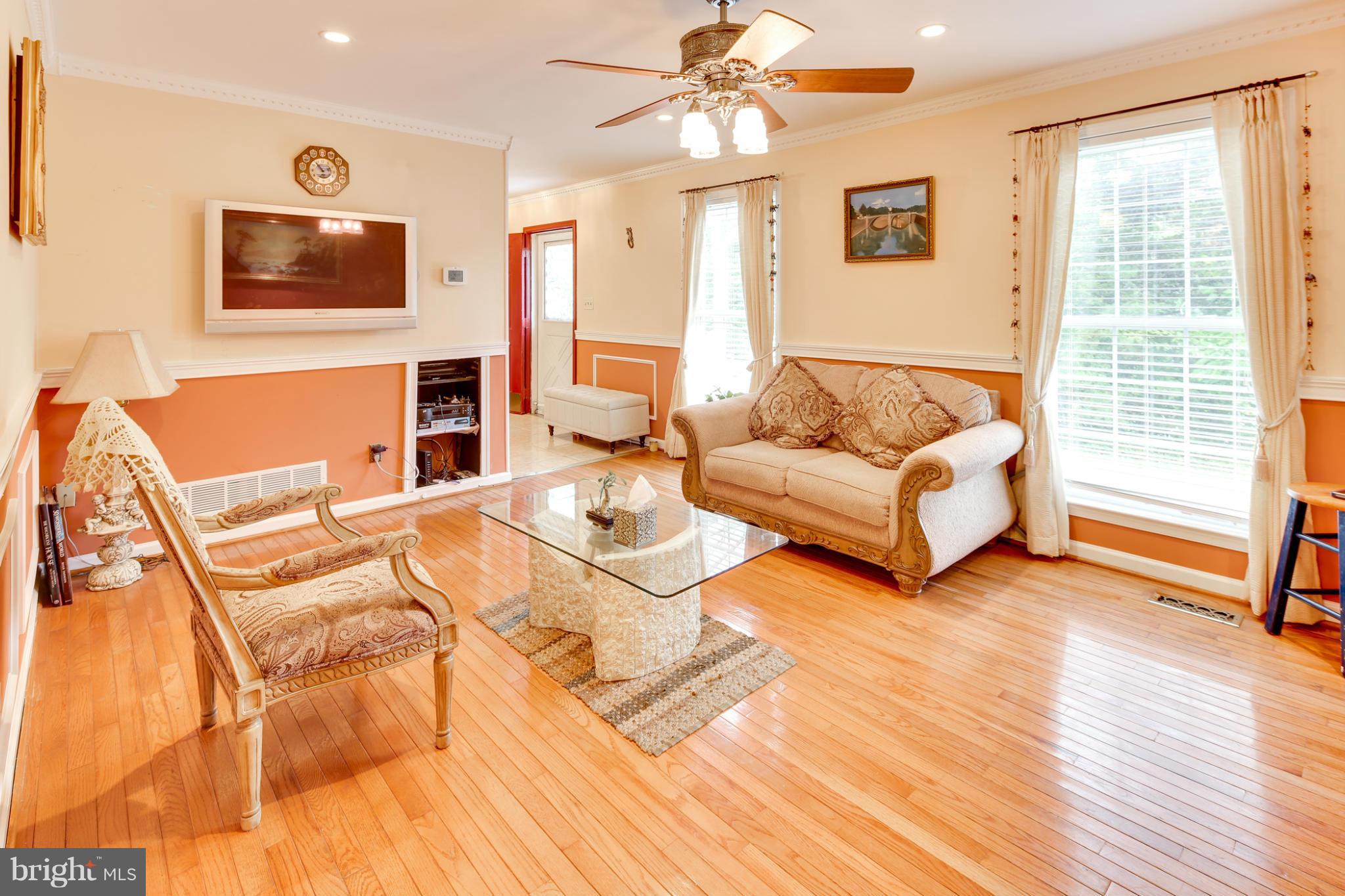 6375 Waterloo Road Elkridge, MD 21075 - Photo 11 of 30 a living room with furniture and a flat screen tv