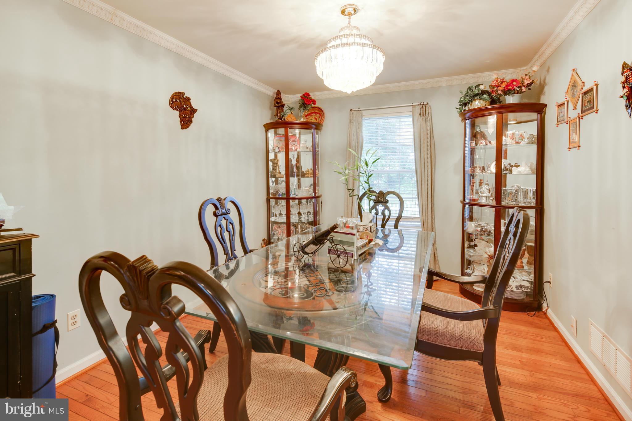 6375 Waterloo Road Elkridge, MD 21075 - Photo 13 of 30 a view of a dining room with furniture window and wooden floor