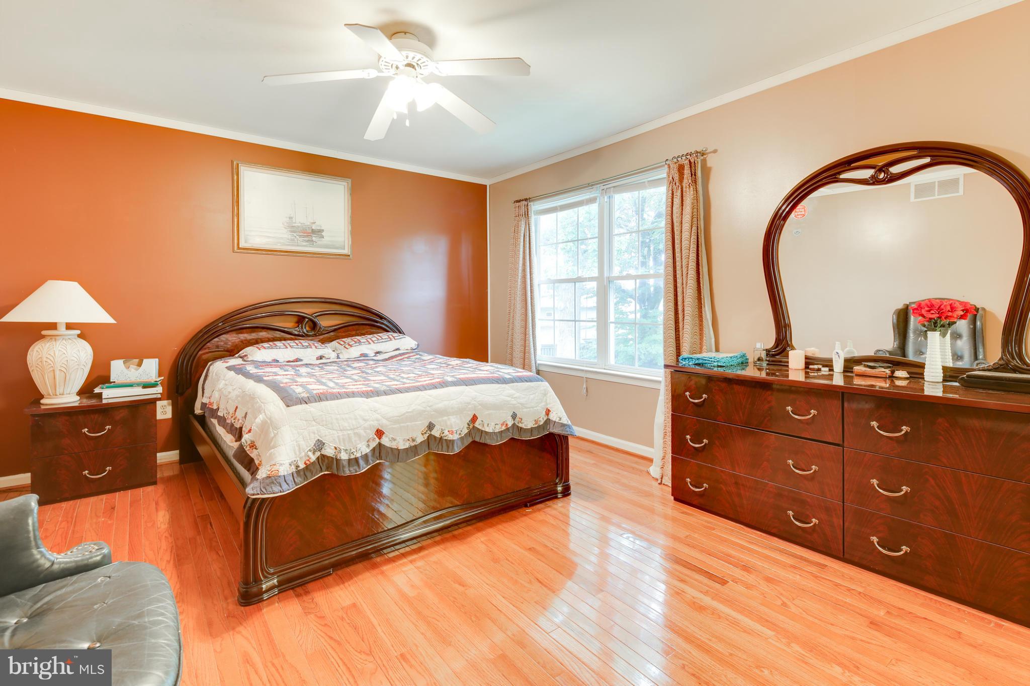 6375 Waterloo Road Elkridge, MD 21075 - Photo 16 of 30 a bedroom with a bed and a dresser