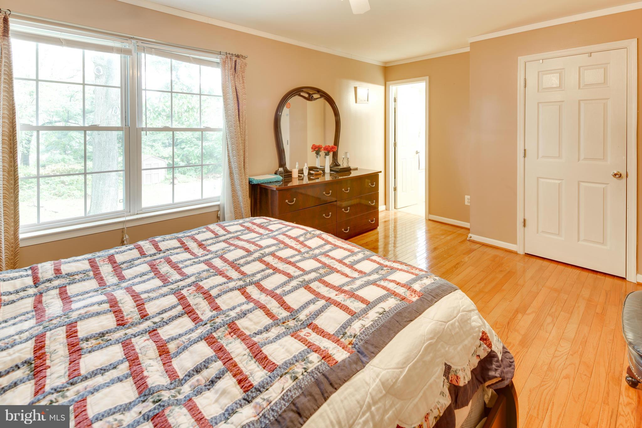 6375 Waterloo Road Elkridge, MD 21075 - Photo 19 of 30 a bedroom with a bed and a large window