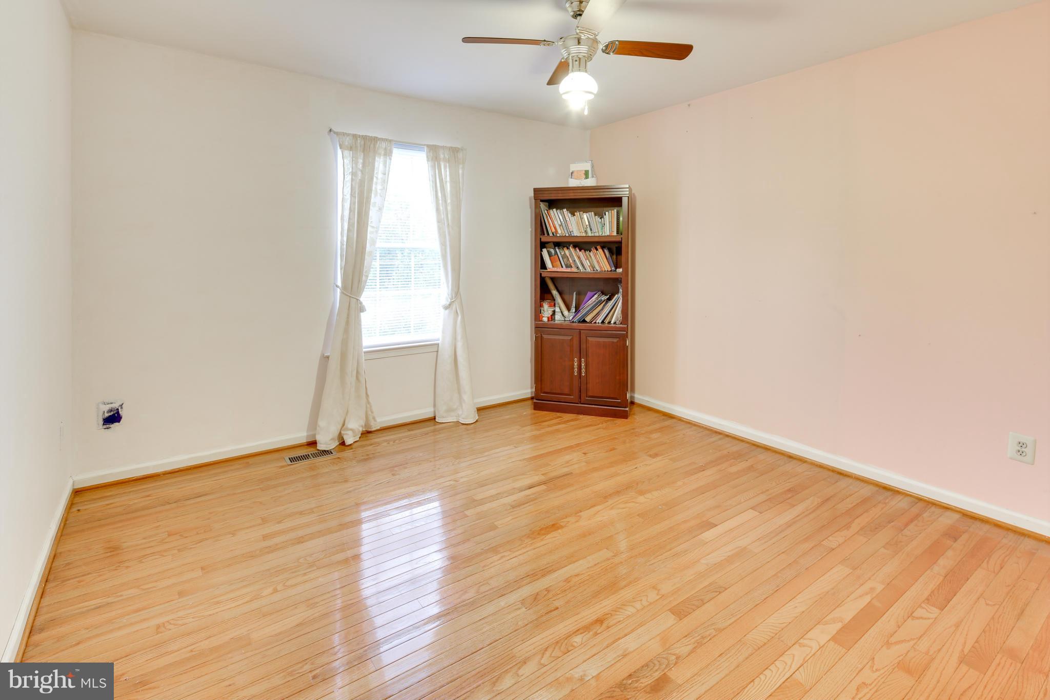 6375 Waterloo Road Elkridge, MD 21075 - Photo 20 of 30 an empty room with wooden floor and windows