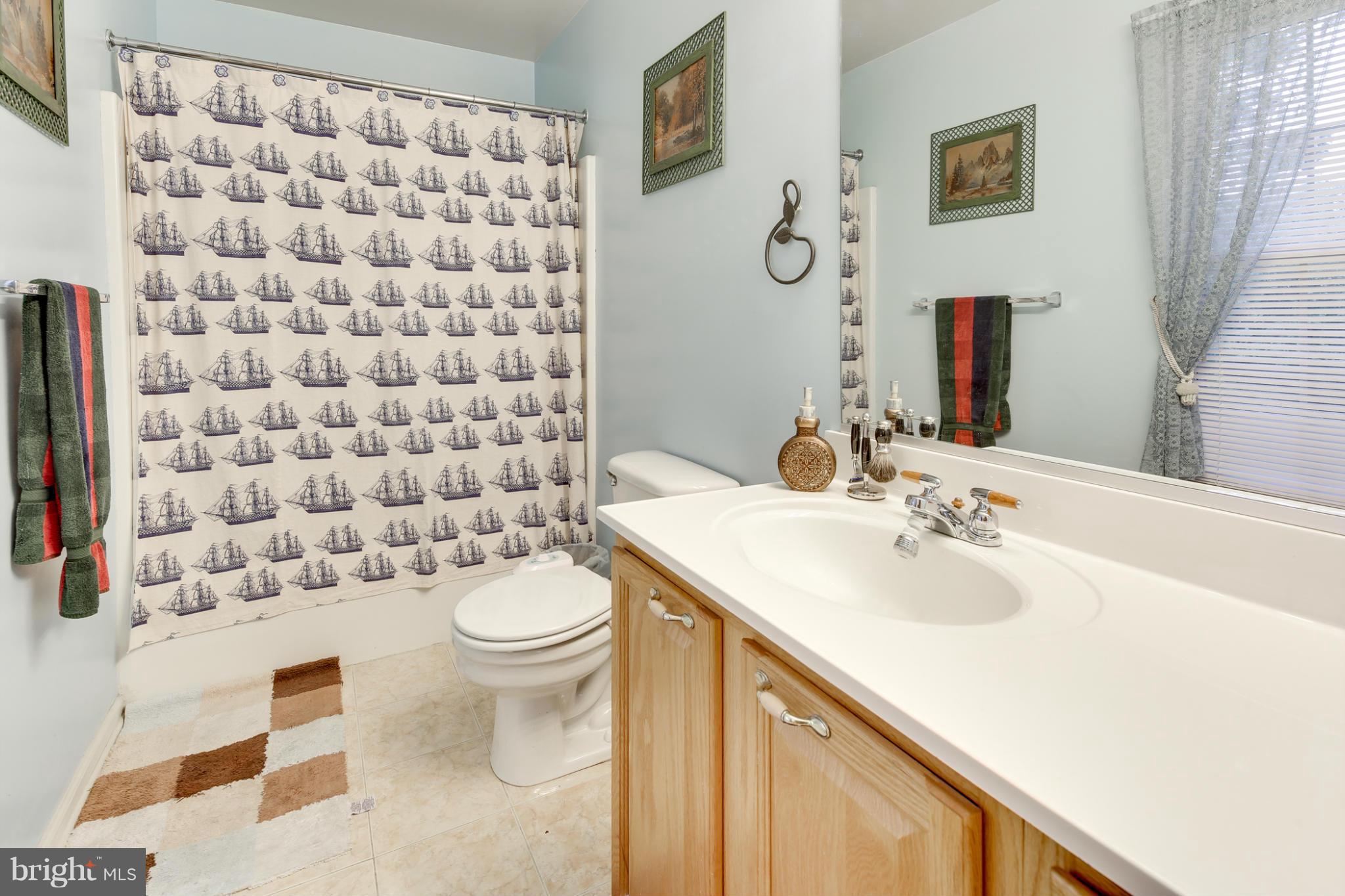 6375 Waterloo Road Elkridge, MD 21075 - Photo 22 of 30 a bathroom with a sink toilet and shower