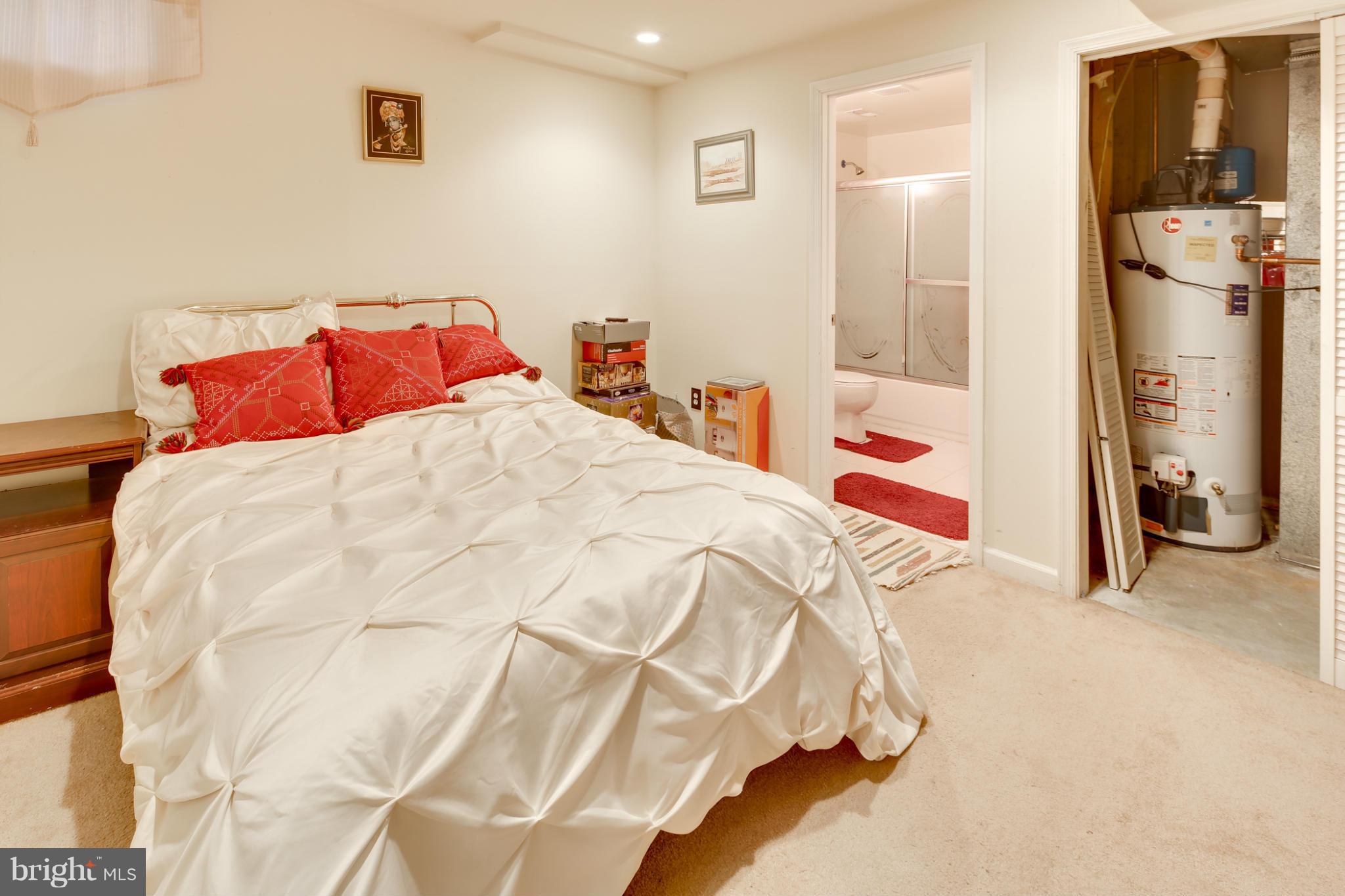 6375 Waterloo Road Elkridge, MD 21075 - Photo 23 of 30 a bed sitting in a bedroom next to a window