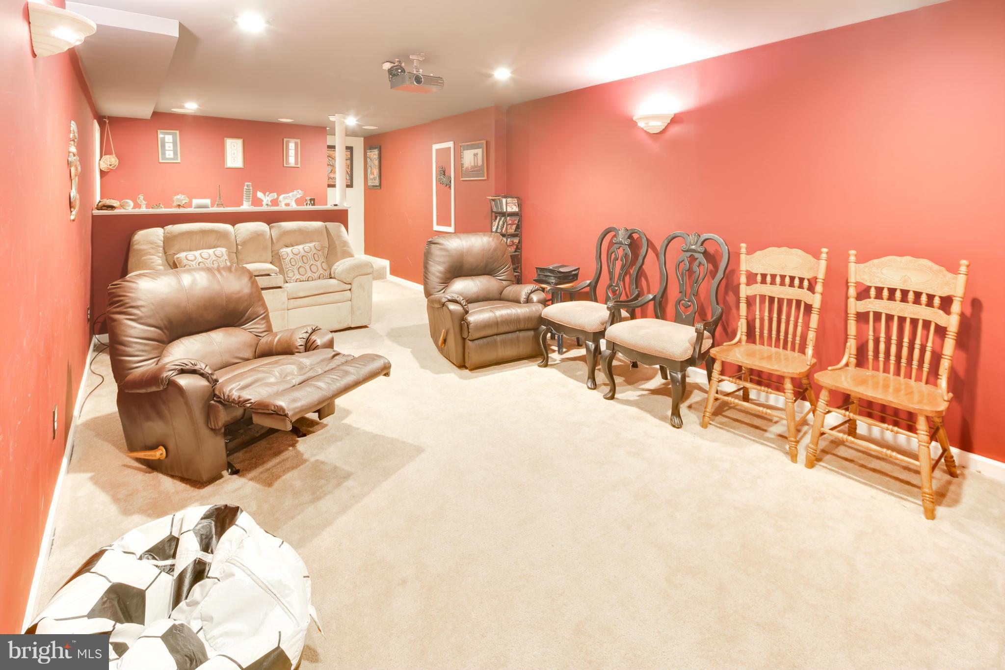 6375 Waterloo Road Elkridge, MD 21075 - Photo 25 of 30 a living room with furniture and a flat screen tv