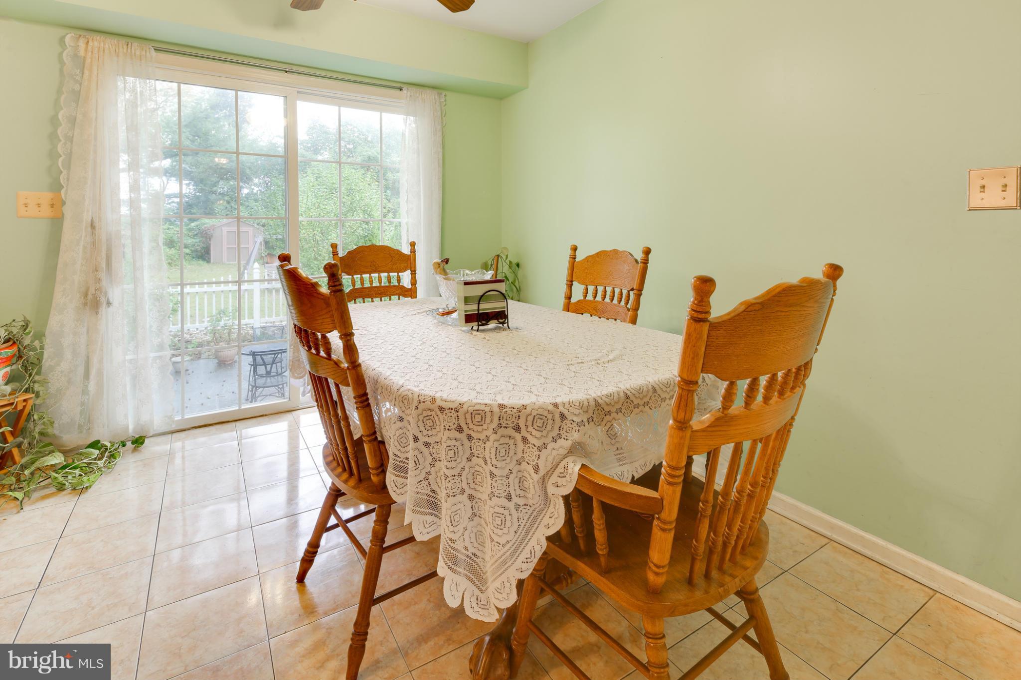 6375 Waterloo Road Elkridge, MD 21075 - Photo 7 of 30 a view of a dining room with furniture and a window