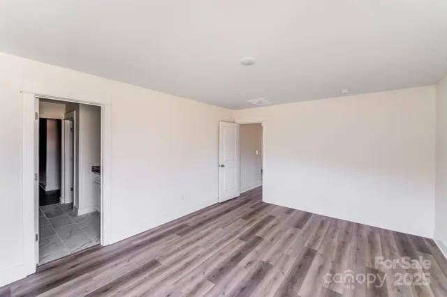 a bathroom with a granite countertop sink and shower