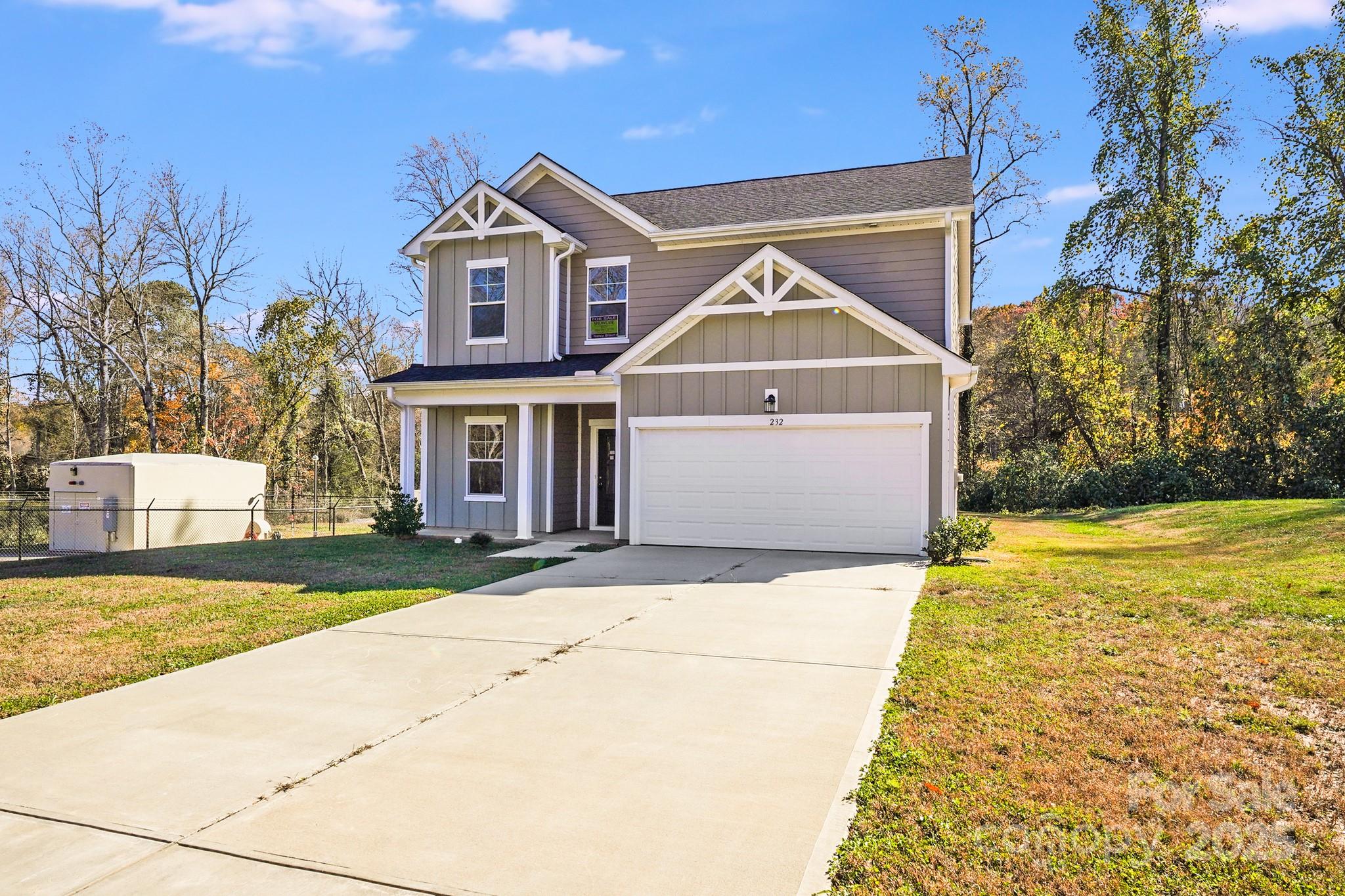 232 Sugar Hill Road Troutman, NC 28166 - Photo 35 of 37 a front view of a house with a yard