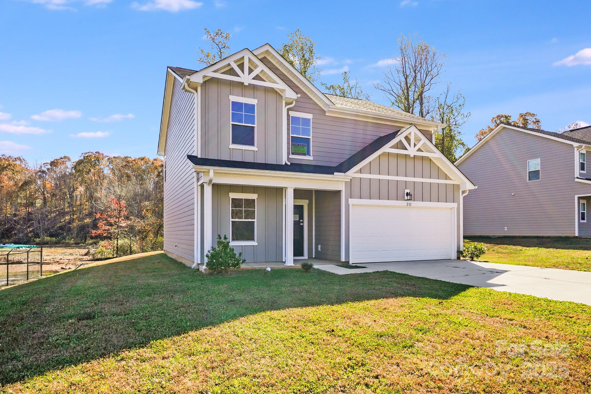 232 Sugar Hill Road Troutman, NC 28166 - Photo 36 of 37 a front view of a house with a yard