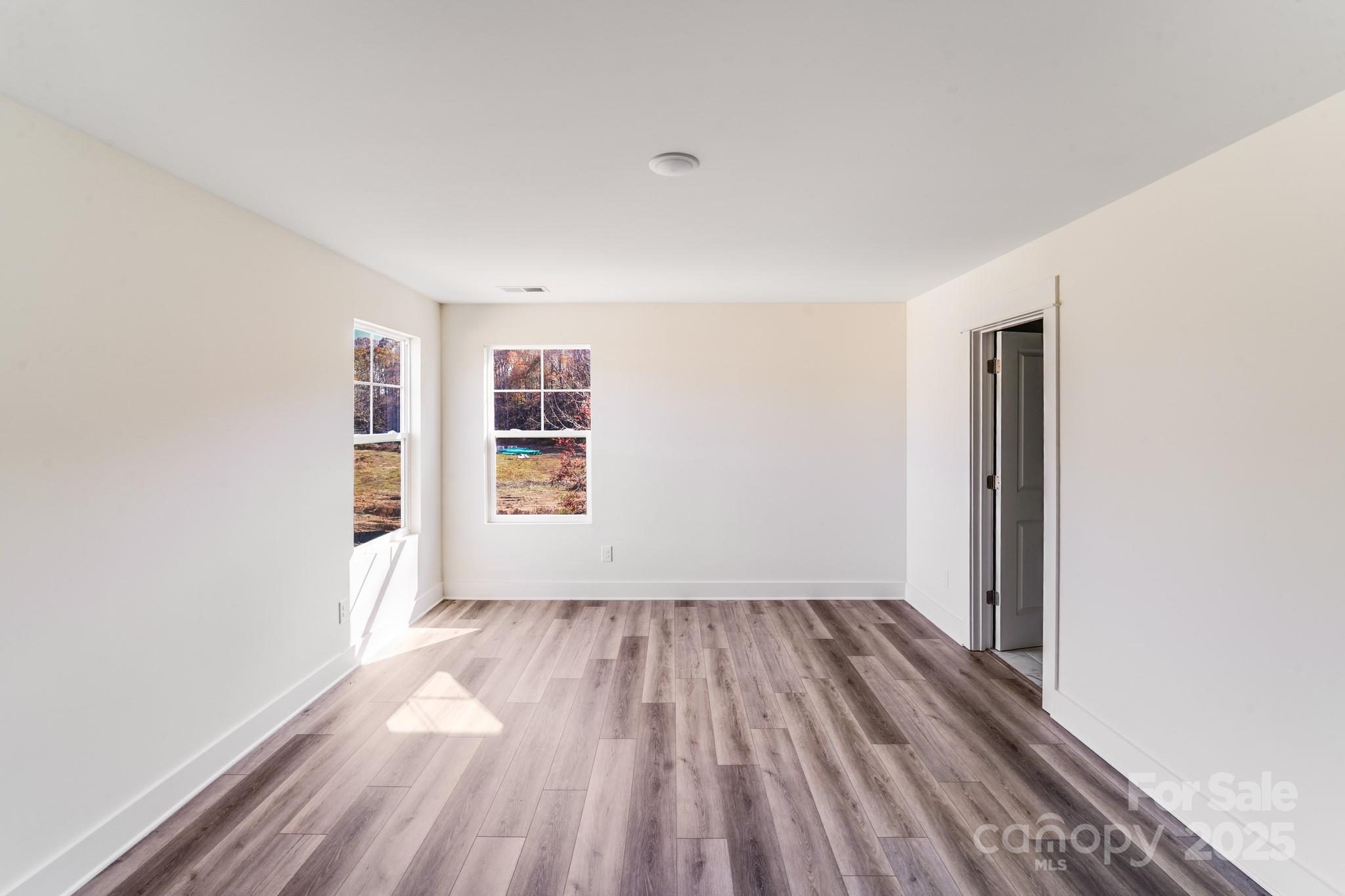 232 Sugar Hill Road Troutman, NC 28166 - Photo 5 of 37 a view of livingroom with hardwood floor and window