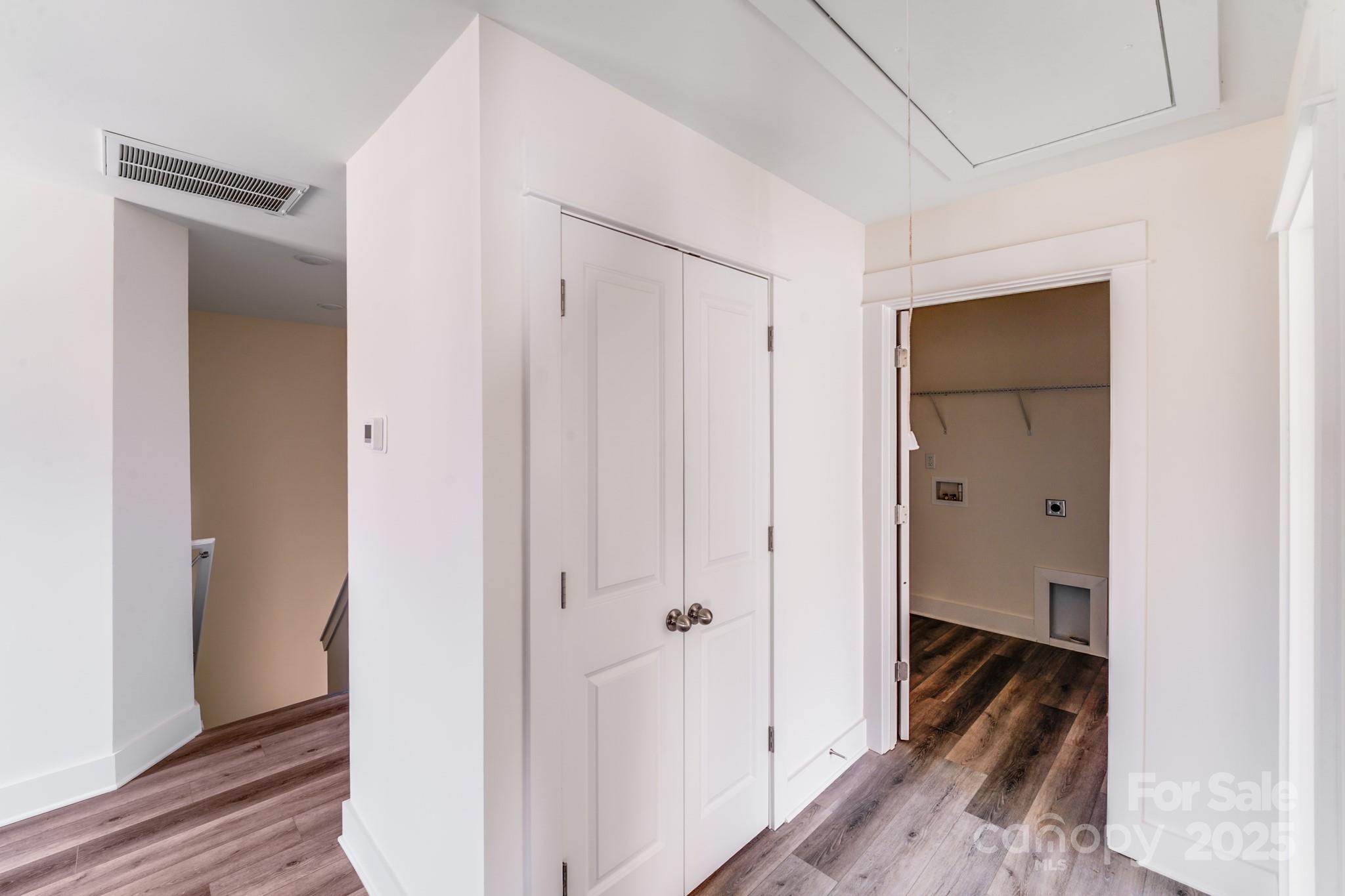 232 Sugar Hill Road Troutman, NC 28166 - Photo 9 of 37 a view of a hallway with wooden floor