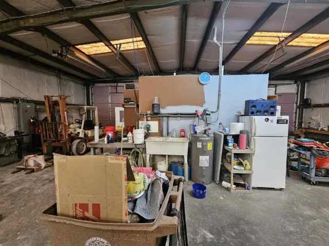 a view of a storage room with furniture fridge and stairs