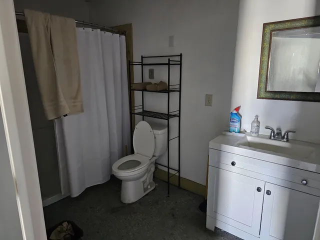 a bathroom with a toilet and a sink