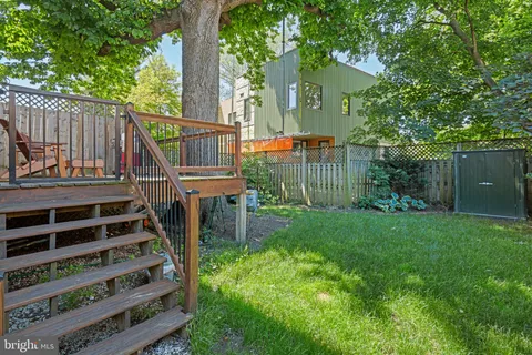 a kitchen with stainless steel appliances granite countertop a refrigerator microwave and stove top oven