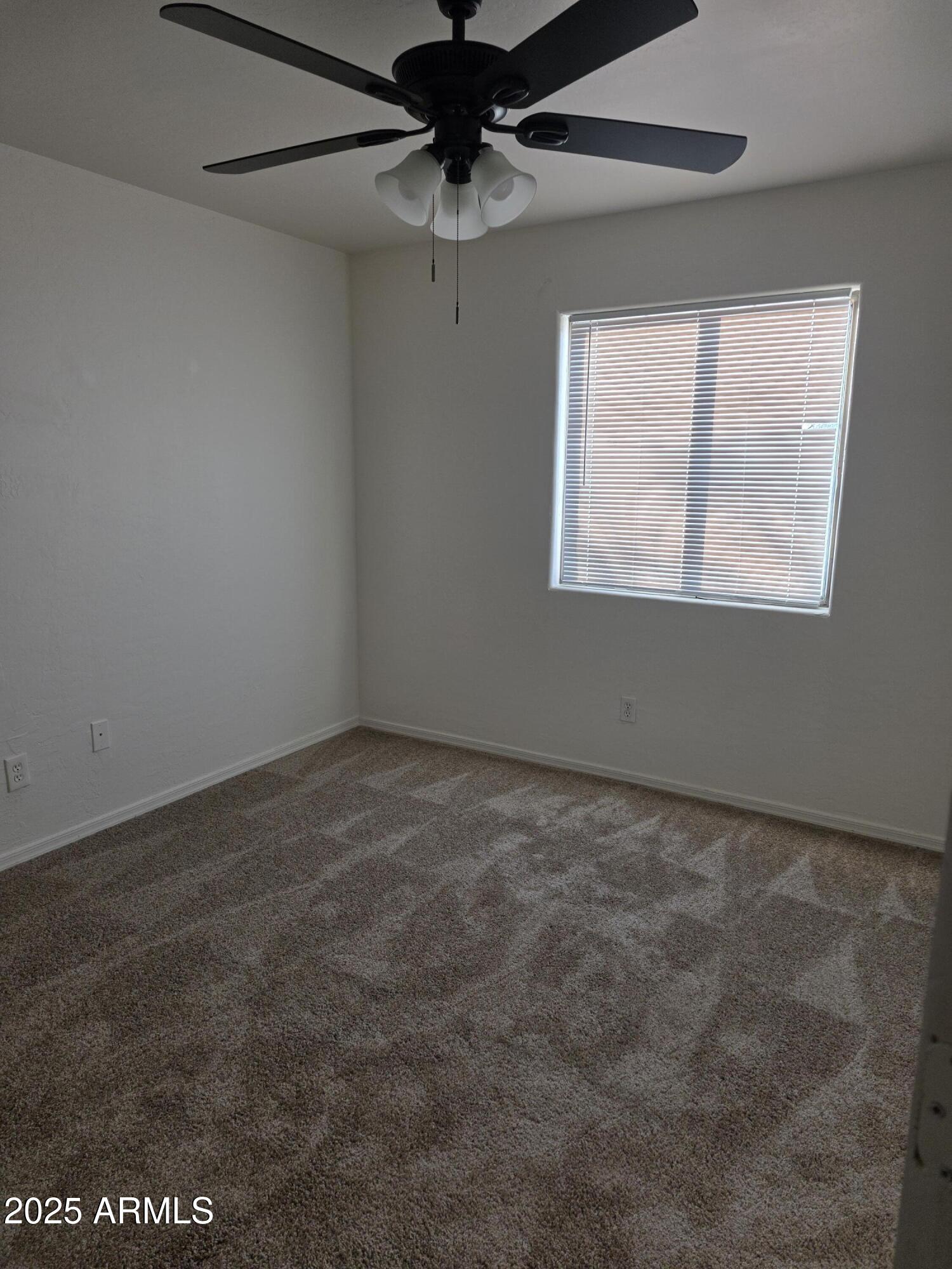 14091 South Berwick Road, Unit 4 Arizona City, AZ 85123 - Photo 6 of 10 an empty room with a window