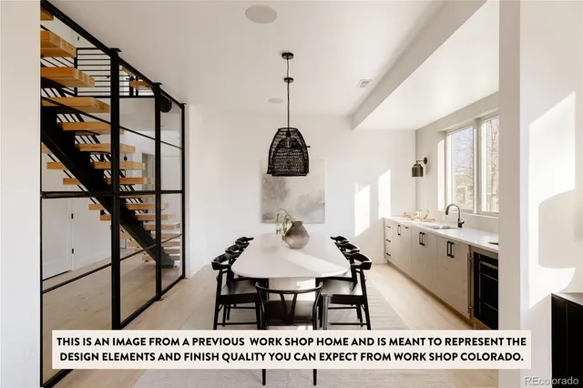 a spacious bedroom with a bed a mirror and a large window