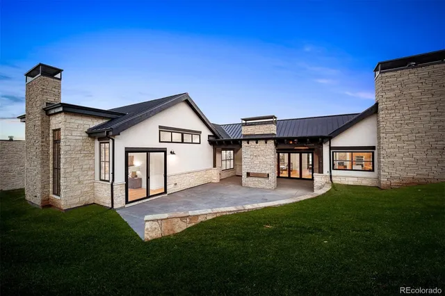 a kitchen with kitchen island granite countertop a sink cabinets and stainless steel appliances