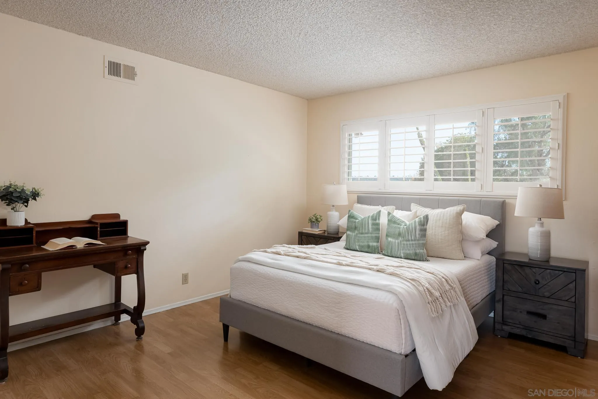13995 Belvedere Drive Poway, CA 92064 - Photo 15 of 54 a bedroom with a bed and a desk