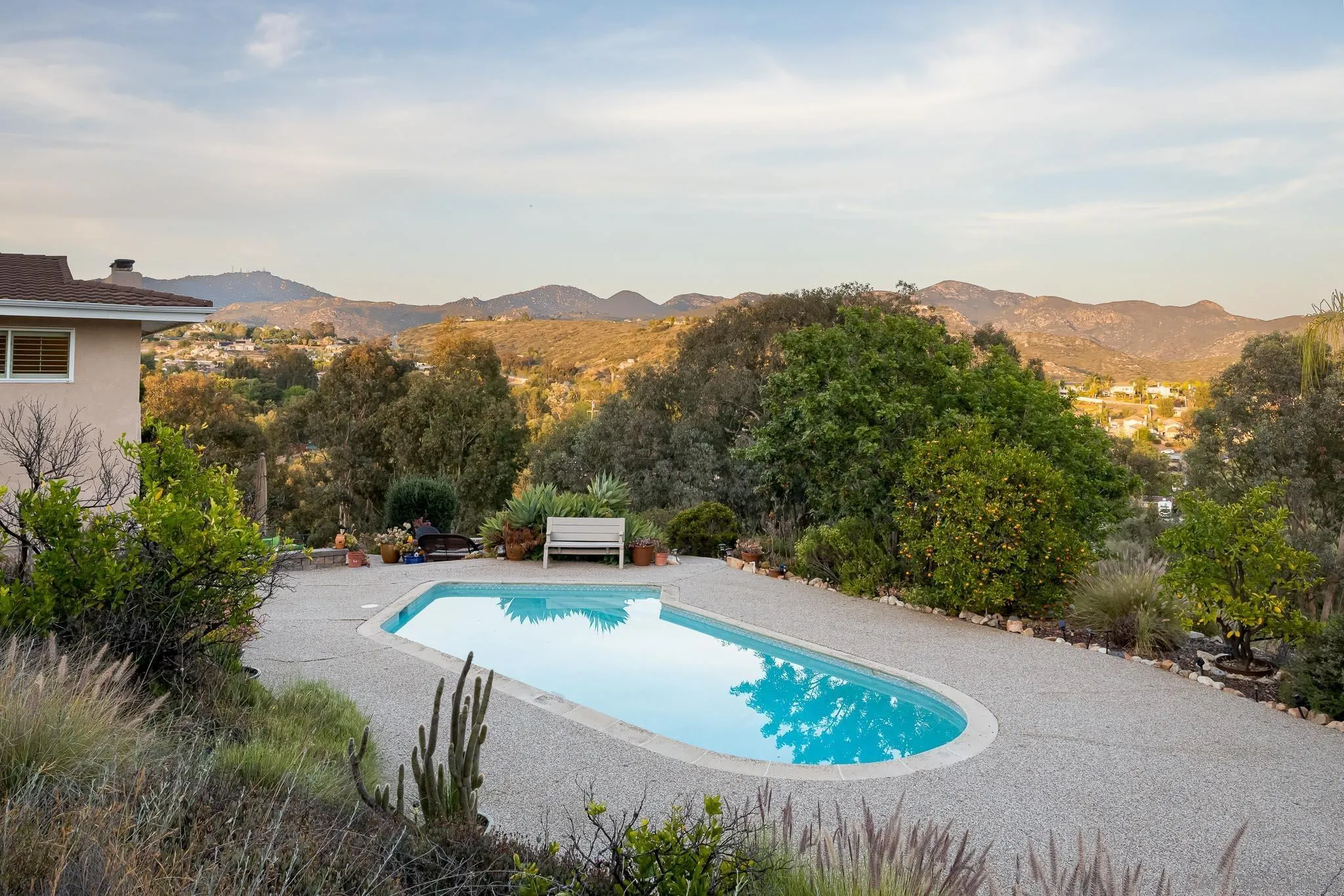 13995 Belvedere Drive Poway, CA 92064 - Photo 28 of 54 an aerial view of a house with a yard and mountains in the background
