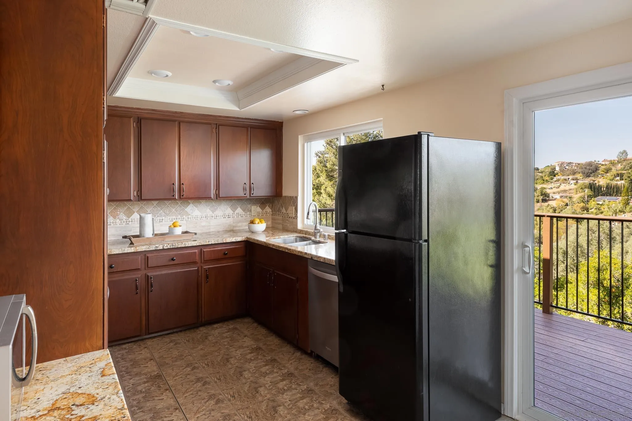13995 Belvedere Drive Poway, CA 92064 - Photo 7 of 54 a kitchen with stainless steel appliances granite countertop a refrigerator and a sink