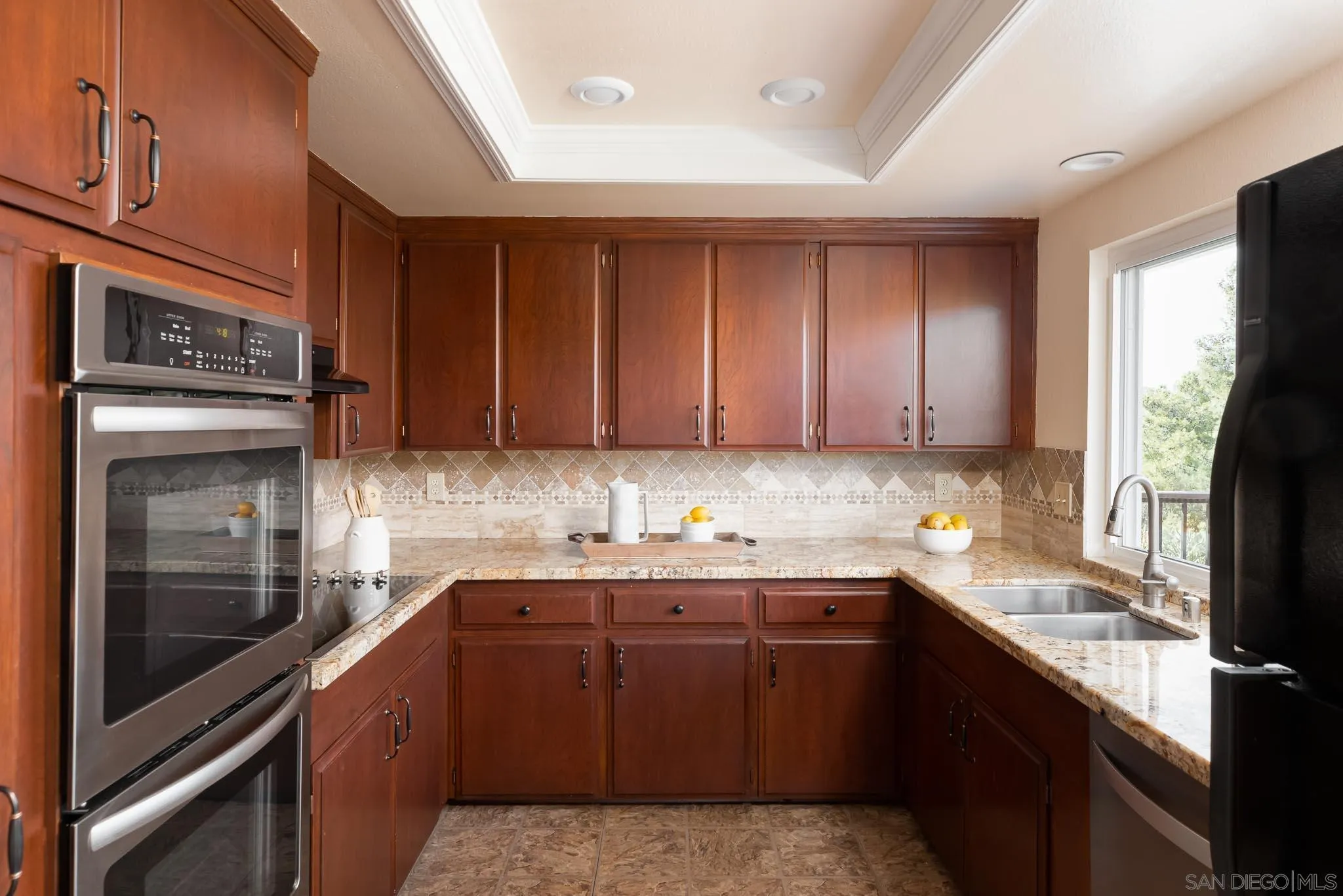 13995 Belvedere Drive Poway, CA 92064 - Photo 10 of 54 a kitchen with a sink stove and cabinets