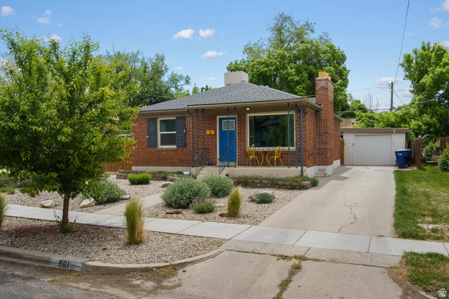 961 33rd Street Ogden, UT 84403 - Photo 2 of 39 Brick single-story residence featuring a blue entry door and dark shutters