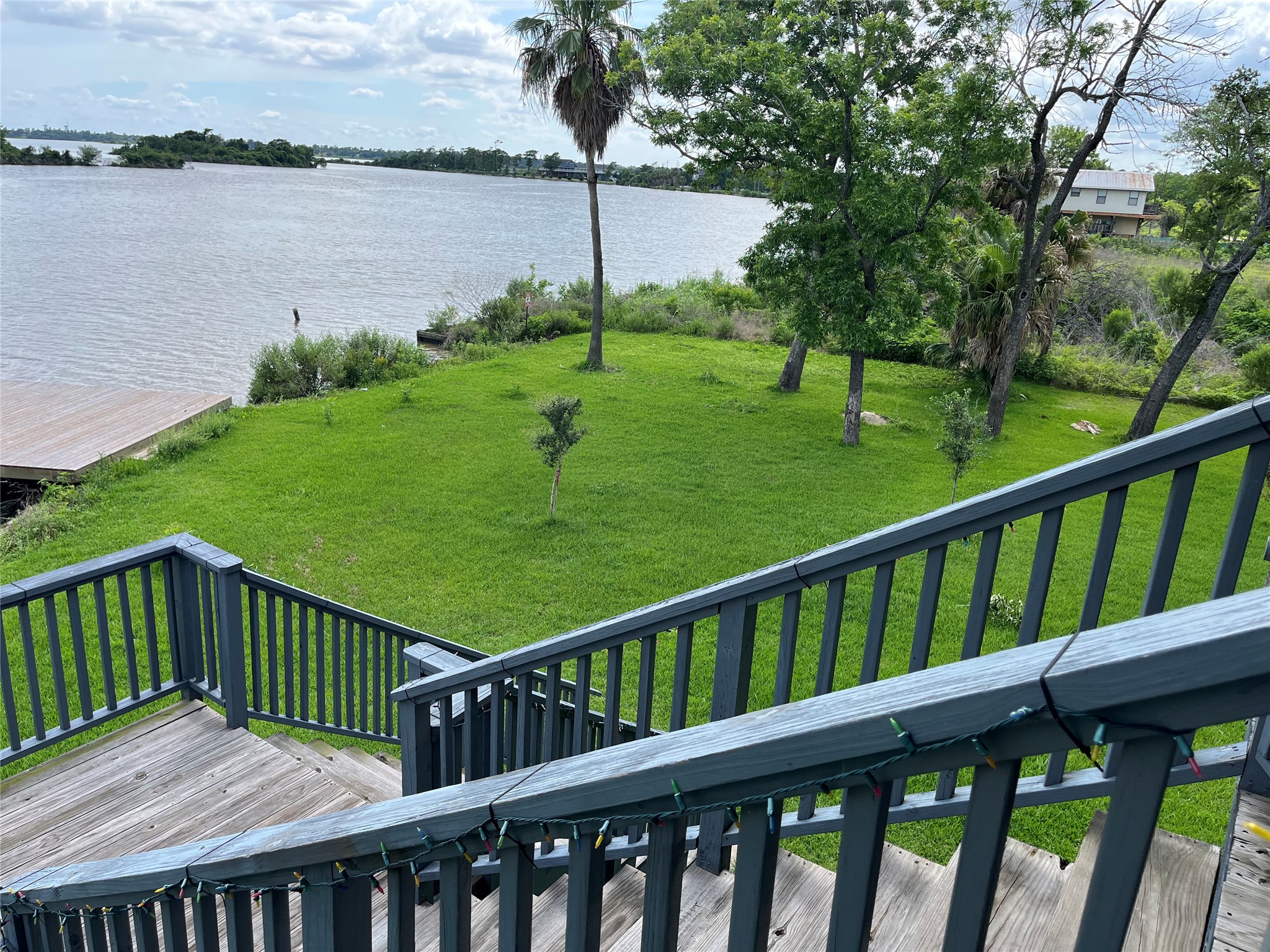 21511 Rio Villa Drive Houston, TX 77049 - Photo 14 of 45 a view of a wooden deck next to a lake