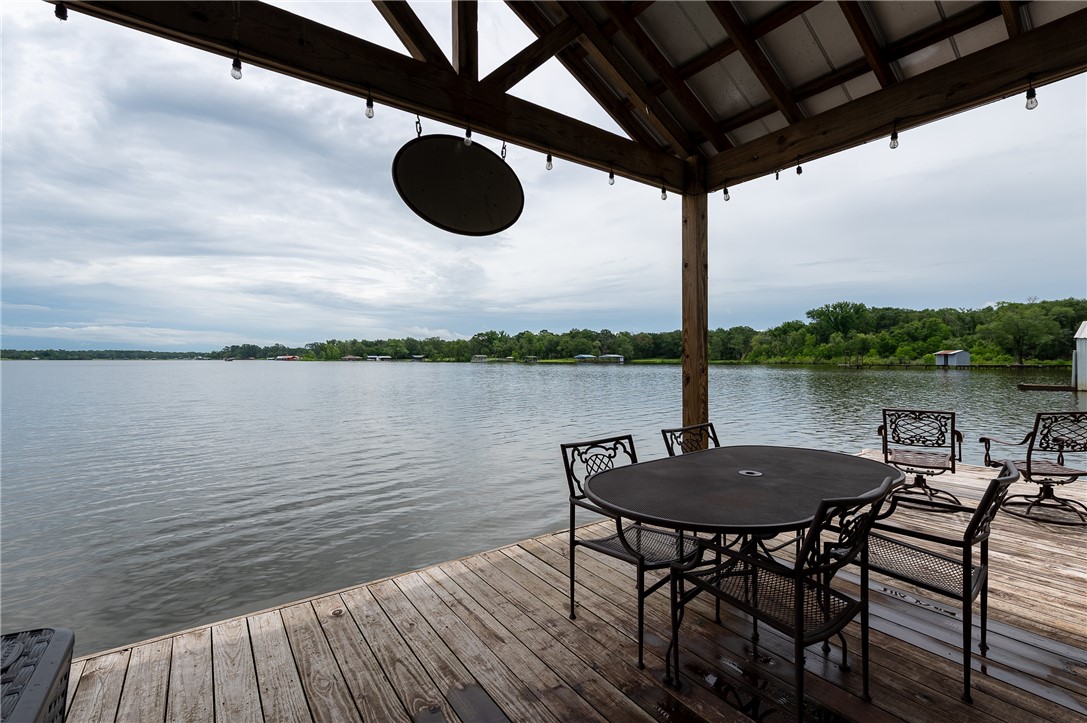 8695 Clyde Acord Road Franklin, TX 77856 - Photo 12 of 50 View of lake with covered area