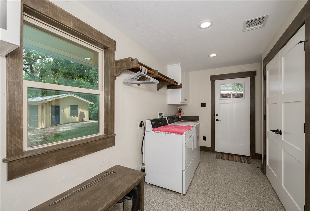 8695 Clyde Acord Road Franklin, TX 77856 - Photo 25 of 50 Laundry room featuring hookup for an electric dryer, cabinet space, and recessed lighting