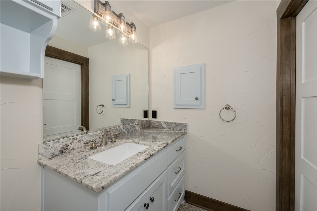 8695 Clyde Acord Road Franklin, TX 77856 - Photo 32 of 50 Bathroom with vanity and baseboards