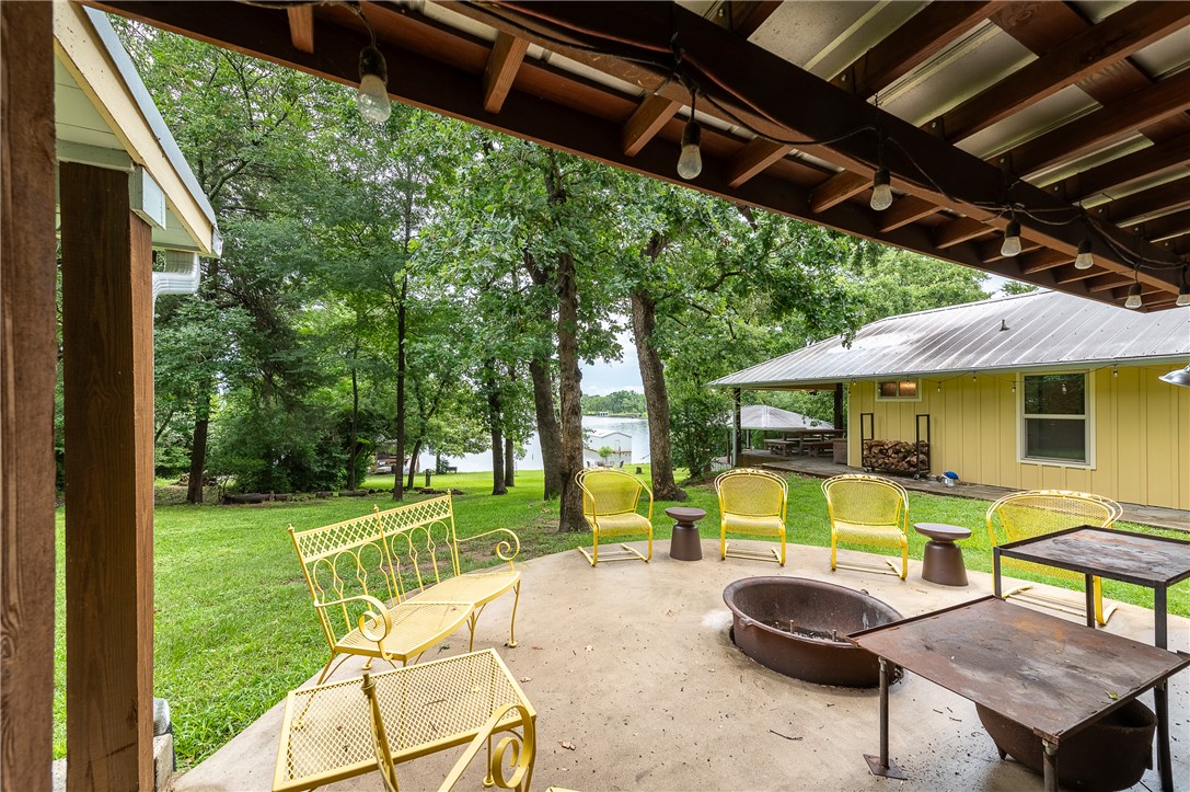 8695 Clyde Acord Road Franklin, TX 77856 - Photo 34 of 50 Casita patio and firepit, lake in background