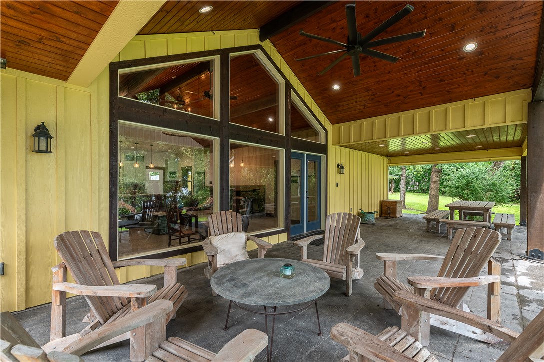 8695 Clyde Acord Road Franklin, TX 77856 - Photo 4 of 50 Covered porch with seating and dining area