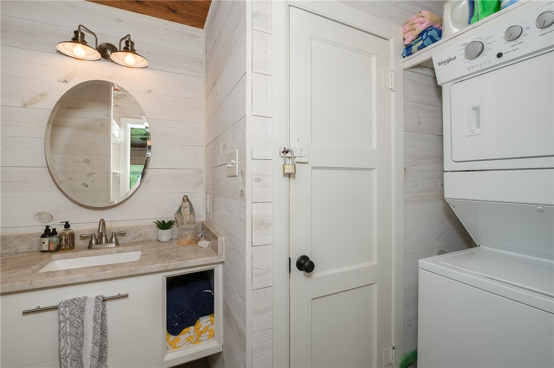 8695 Clyde Acord Road Franklin, TX 77856 - Photo 45 of 50 Bathroom with stacked washer / dryer and vanity