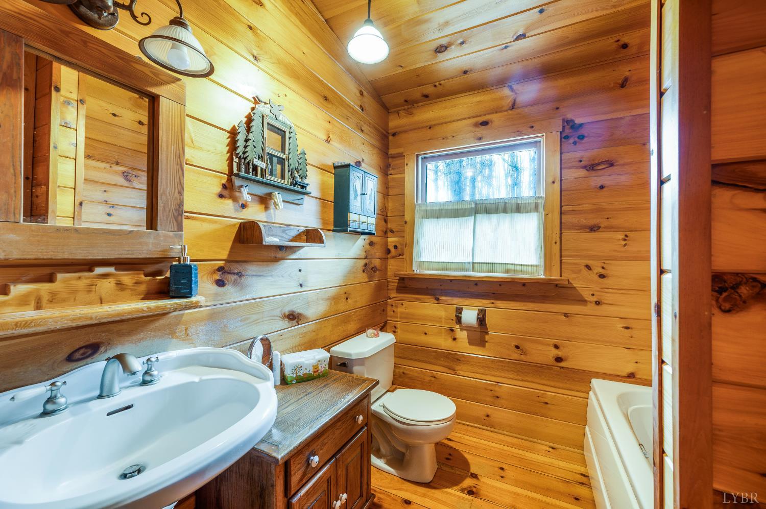 2080 Keys Church Road Shipman, VA 22971 - Photo 24 of 53 a bathroom with a granite countertop sink and a large mirror