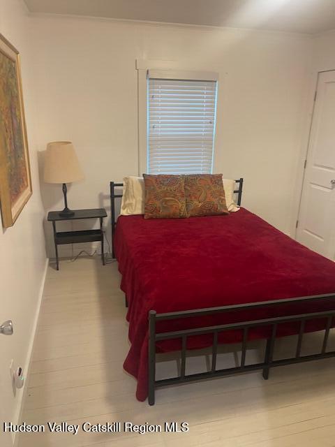 9580 Rte 9W Athens, NY 12015 - Photo 22 of 35 a bedroom with a bed and a stool