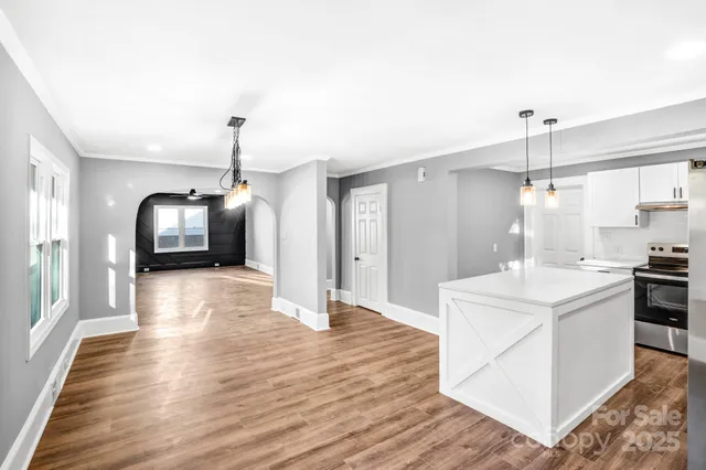 a kitchen with refrigerator and window