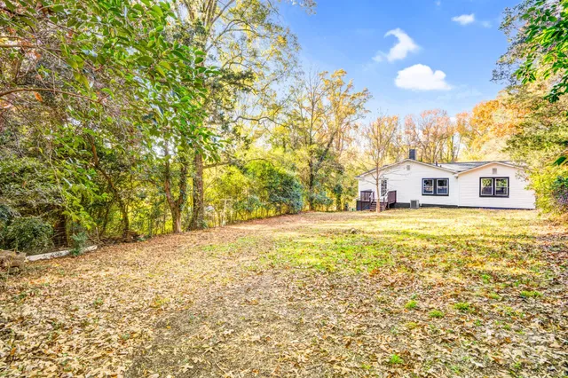 a view of a house with a window and wooden floor