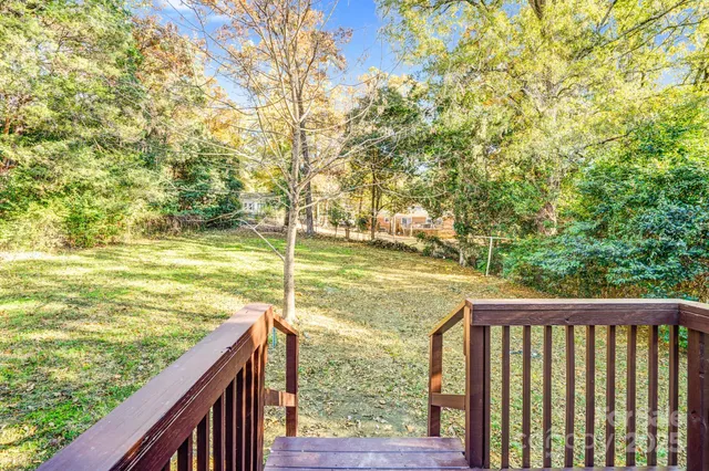 a view of house with a tree in front of it