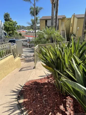 a view of a backyard of a house with a garden