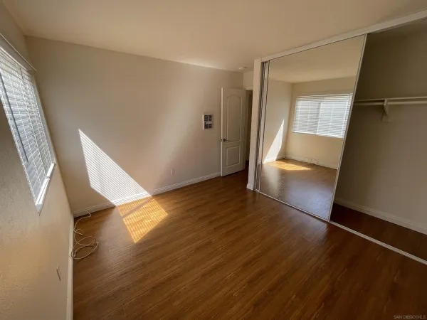 an entryway of a house with wooden floor