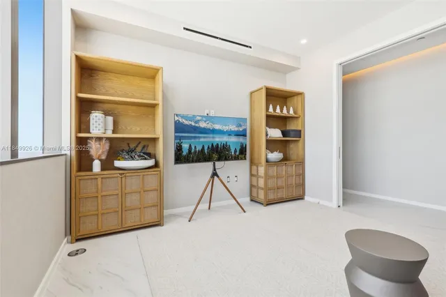 a room with a chair and a stove top oven