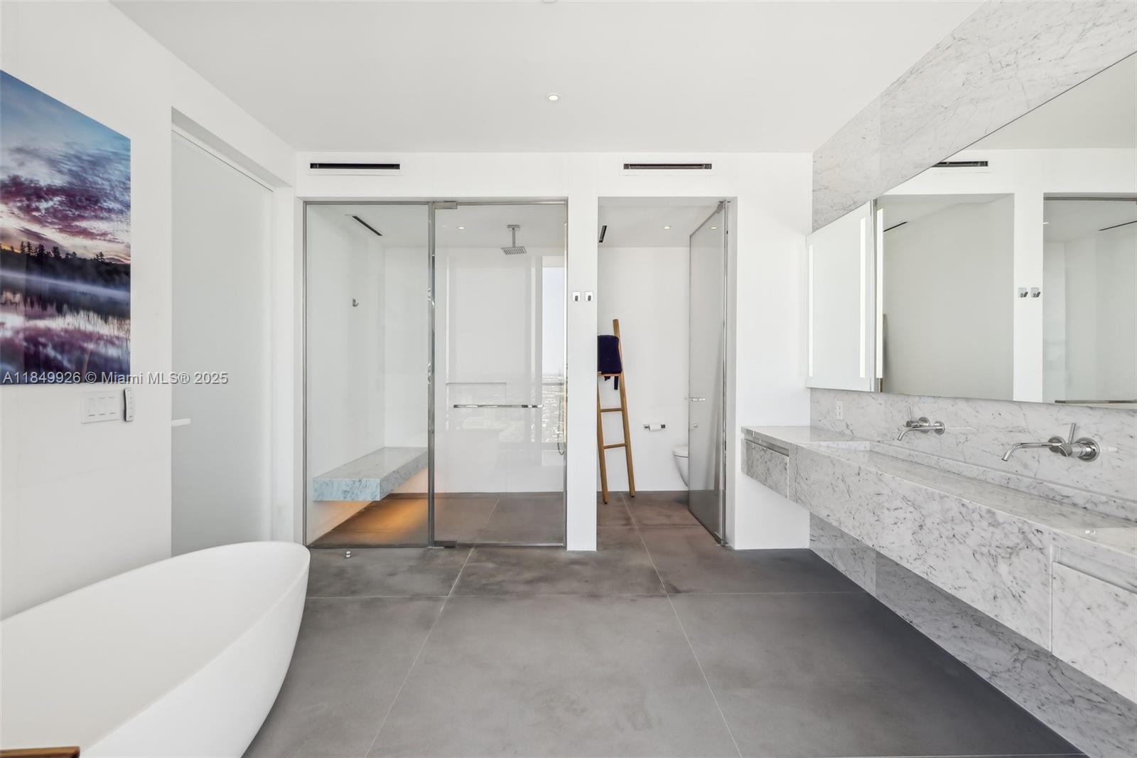 2000 South Ocean Drive, Unit 28A Hallandale Beach, FL 33009 - Photo 26 of 66 a bathroom with a tub sink and mirror