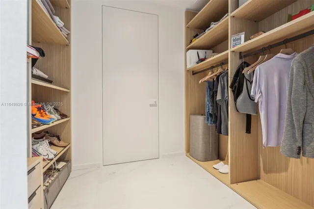 a bedroom with a bed and a night stand