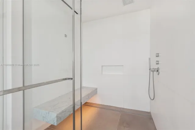 a bathroom with a toilet sink and shower