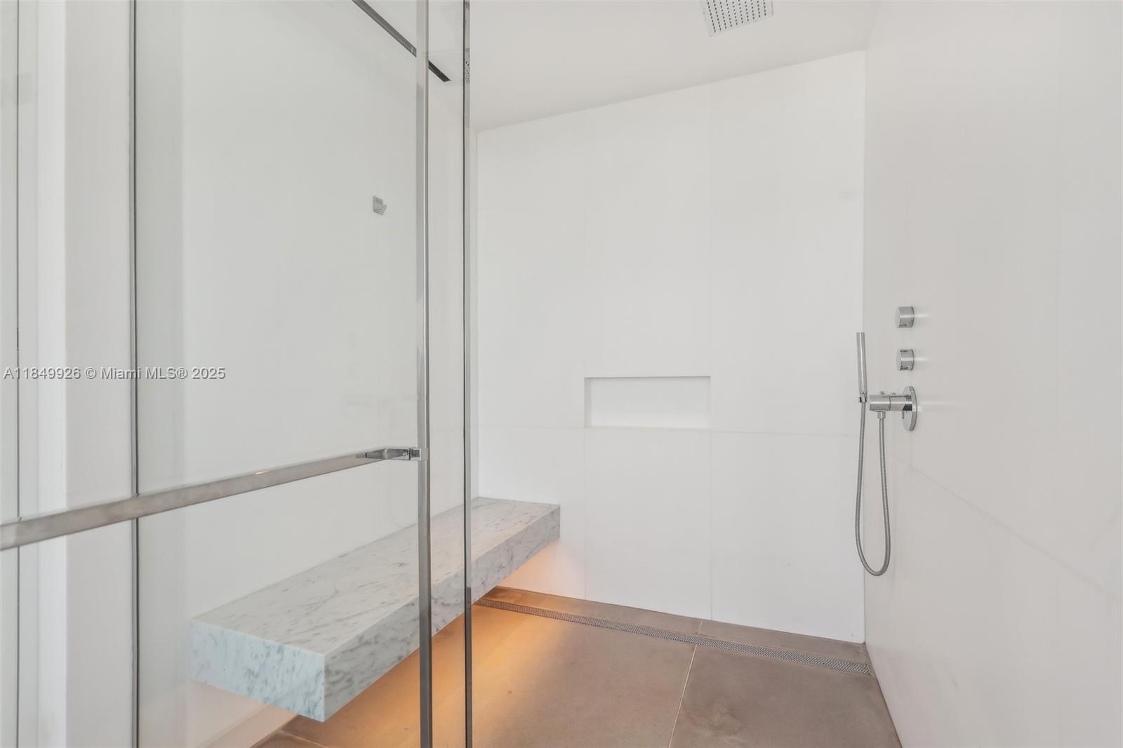 2000 South Ocean Drive, Unit 28A Hallandale Beach, FL 33009 - Photo 29 of 66 a bathroom with a glass shower door