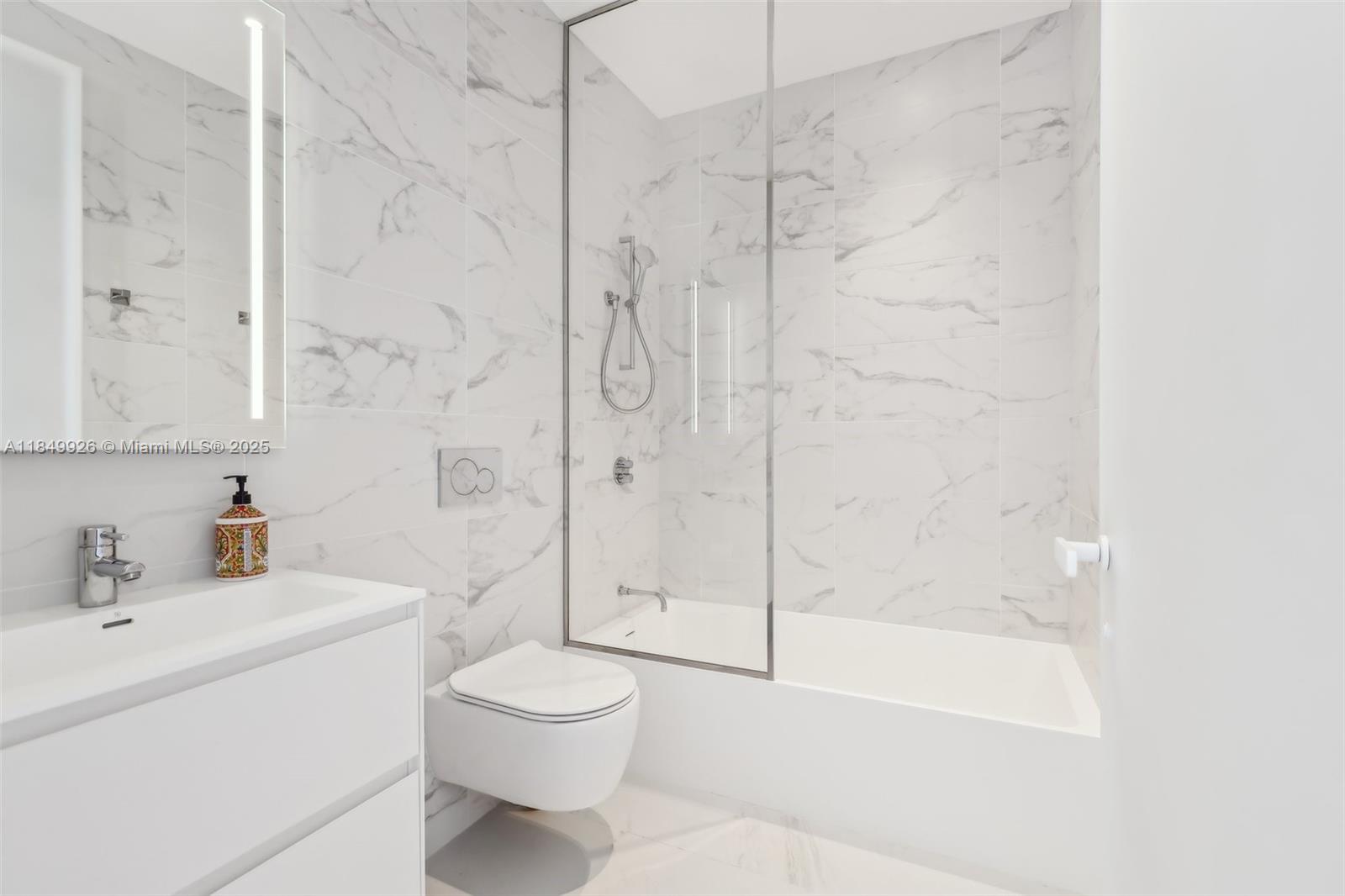 2000 South Ocean Drive, Unit 28A Hallandale Beach, FL 33009 - Photo 36 of 66 a bathroom with a toilet sink and shower