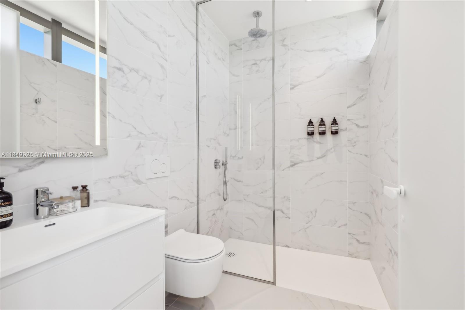 2000 South Ocean Drive, Unit 28A Hallandale Beach, FL 33009 - Photo 40 of 66 a bathroom with a sink toilet and shower