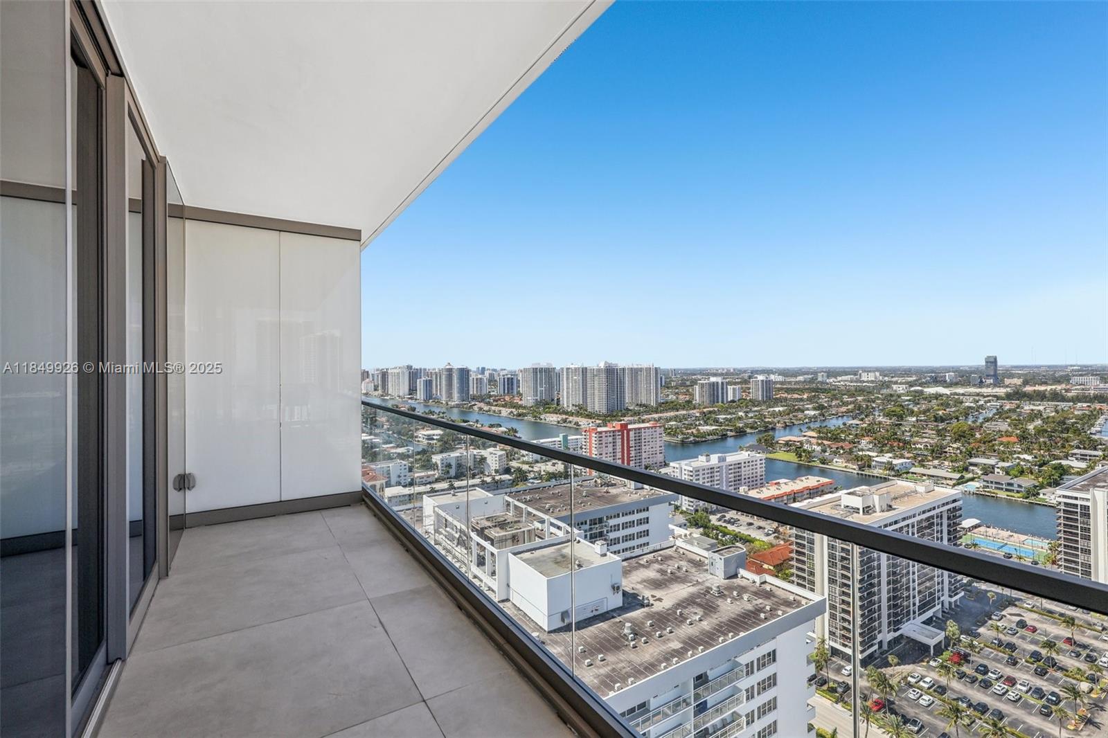 2000 South Ocean Drive, Unit 28A Hallandale Beach, FL 33009 - Photo 48 of 66 a view of a balcony with wooden floor and fence