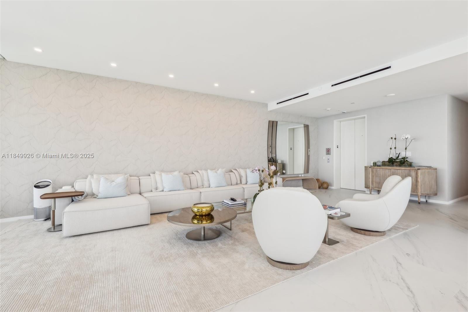 2000 South Ocean Drive, Unit 28A Hallandale Beach, FL 33009 - Photo 6 of 66 a living room with furniture and a mirror