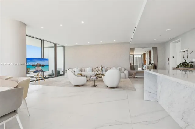 a dining room with furniture window and outdoor view