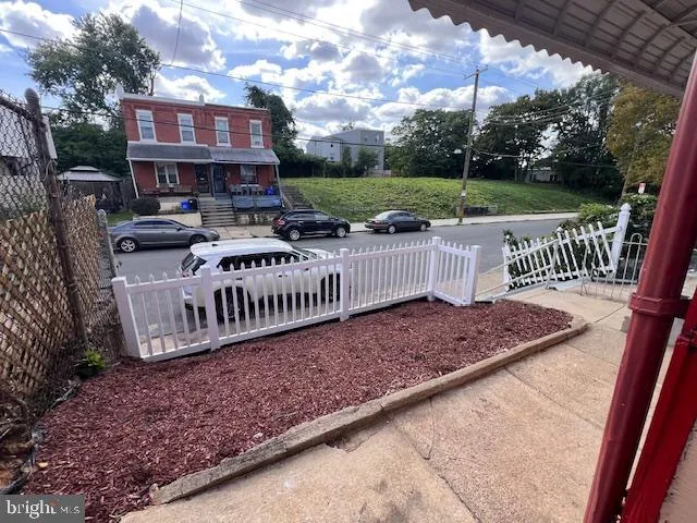 a view of a wooden deck with chairs and a yard
